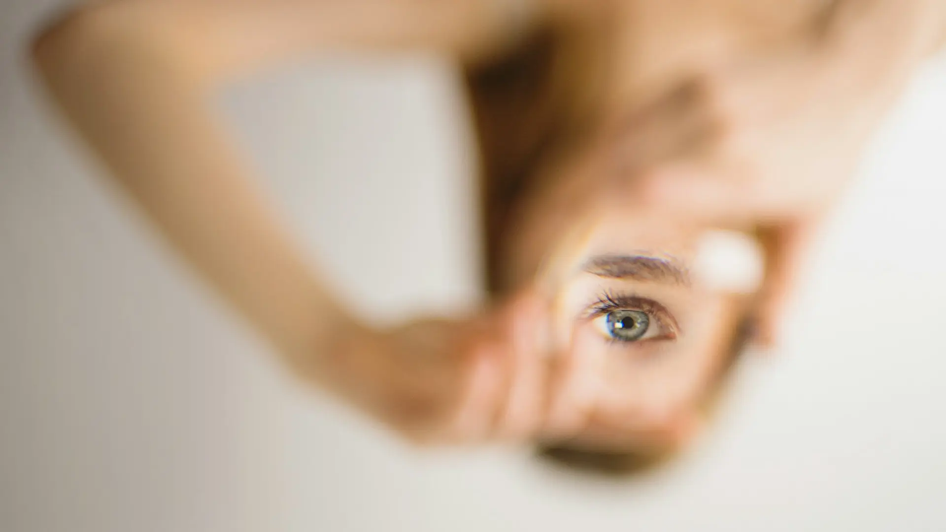 woman holding mirror